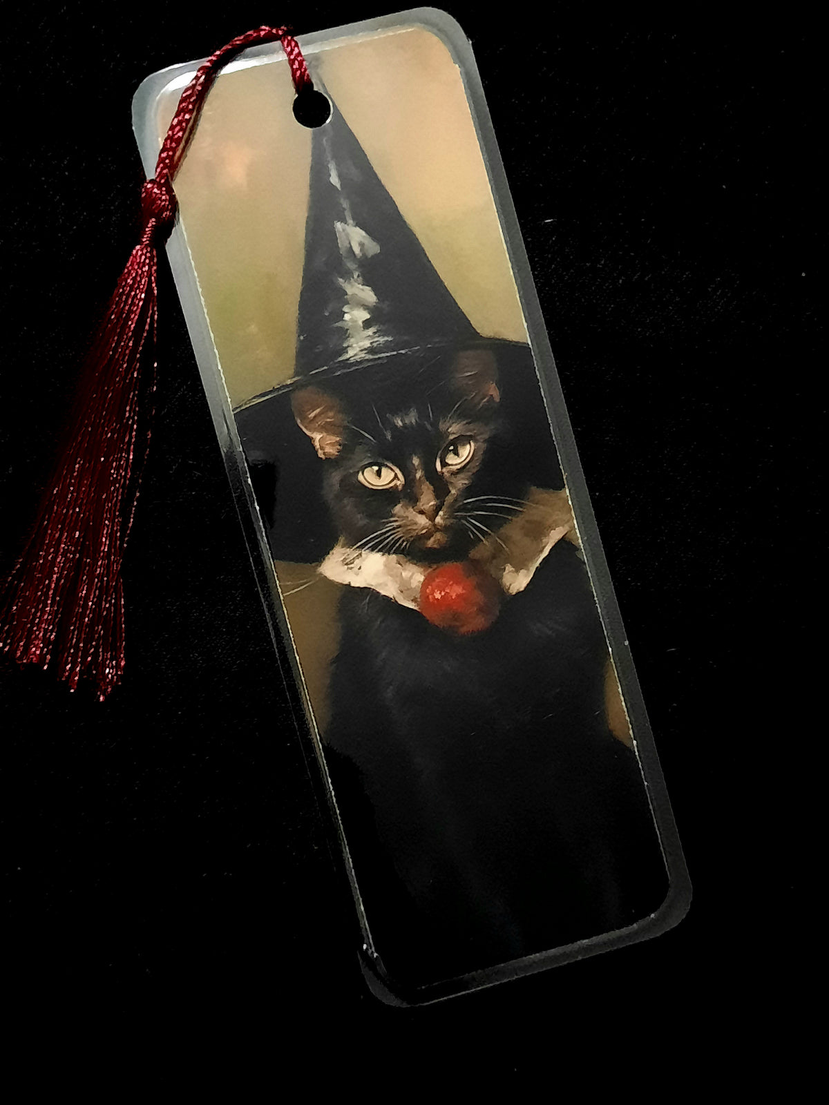 Witchy black cat laminated bookmark. 