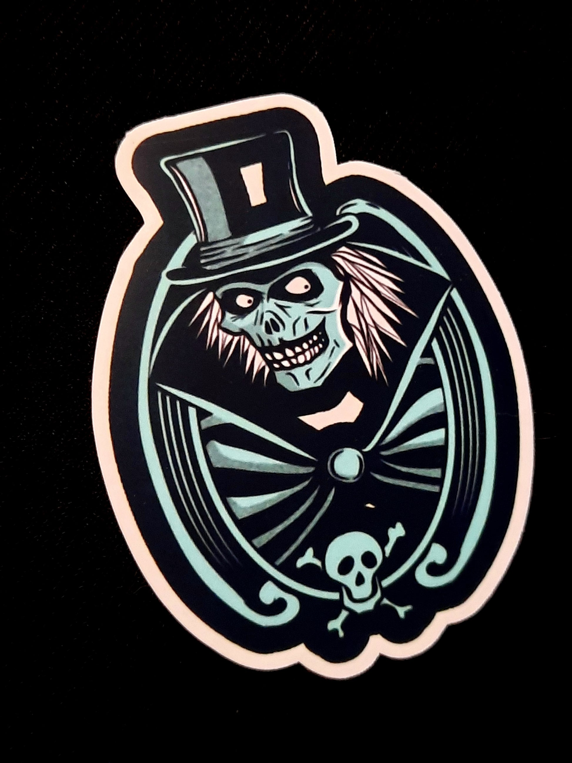 Sticker with a skeleton in a top hat and bow tie on a black background